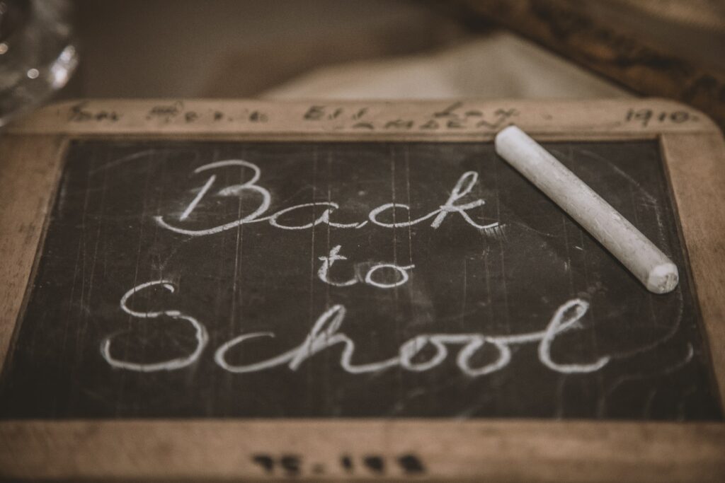 Back to school written in a board with chalk